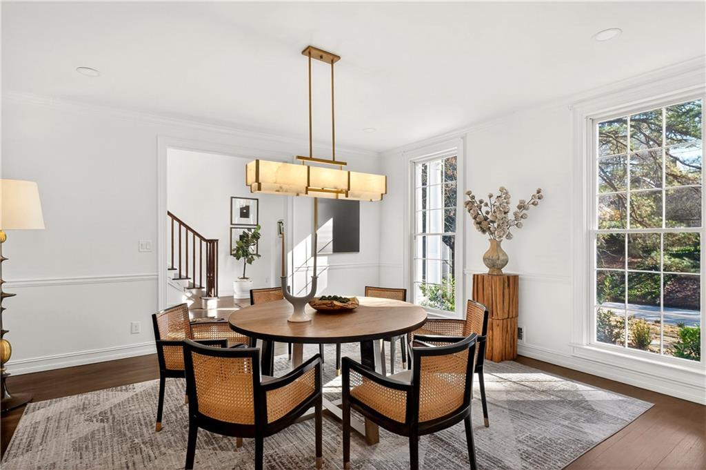 1330 West Wesley Road Northwest Atlanta, GA 30327 - Photo 15 of 46 a view of a dining room with furniture window and wooden floor