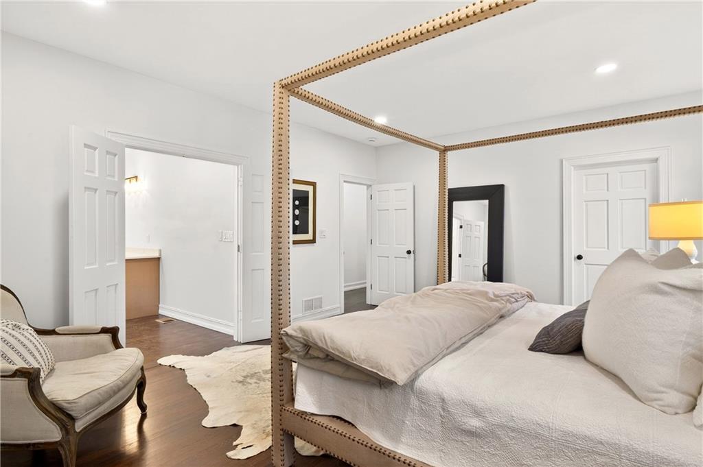 1330 West Wesley Road Northwest Atlanta, GA 30327 - Photo 17 of 46 a bedroom with a bed and a couch