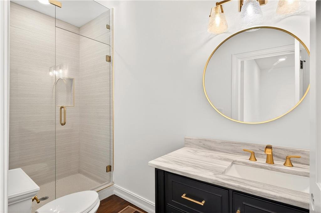 1330 West Wesley Road Northwest Atlanta, GA 30327 - Photo 22 of 46 a bathroom with a sink a toilet and shower