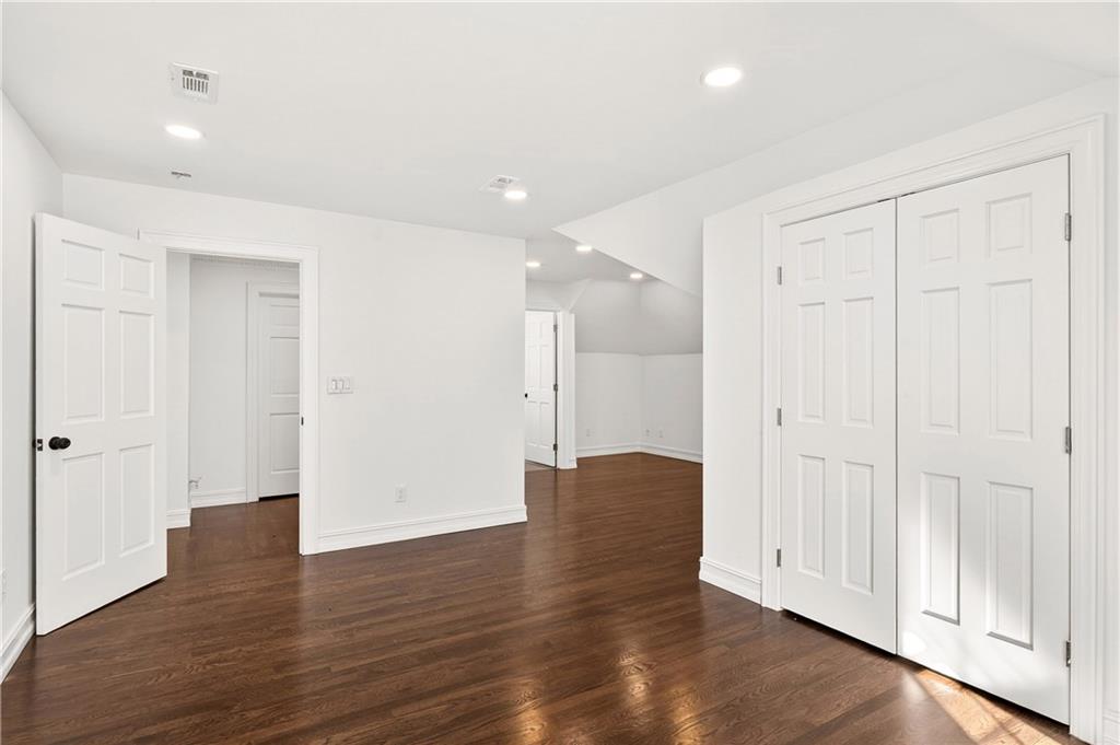 1330 West Wesley Road Northwest Atlanta, GA 30327 - Photo 24 of 46 a view of empty room with wooden floor