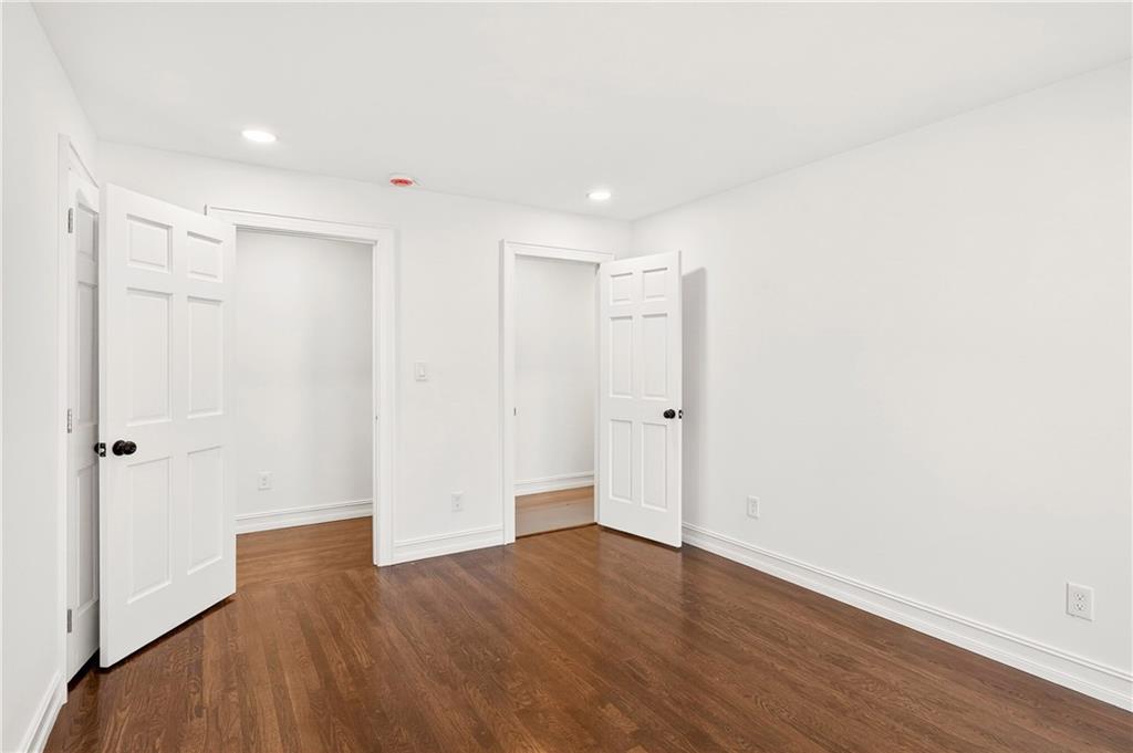 1330 West Wesley Road Northwest Atlanta, GA 30327 - Photo 31 of 46 a view of an empty room with wooden floor