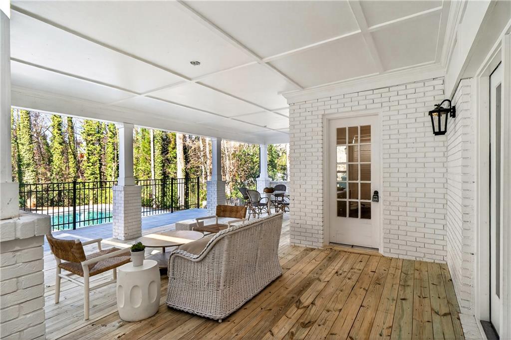1330 West Wesley Road Northwest Atlanta, GA 30327 - Photo 37 of 46 a living room with furniture and a floor to ceiling window