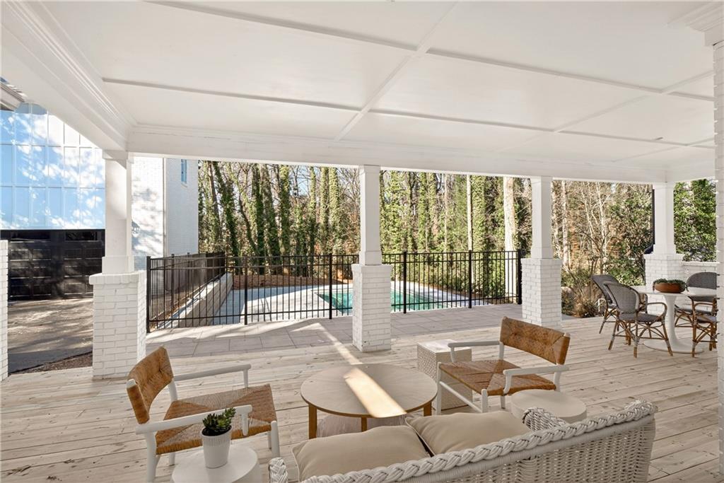 1330 West Wesley Road Northwest Atlanta, GA 30327 - Photo 40 of 46 a building outdoor space with patio furniture and wooden floor