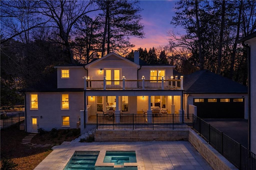 1330 West Wesley Road Northwest Atlanta, GA 30327 - Photo 44 of 46 a front view of a house with a yard