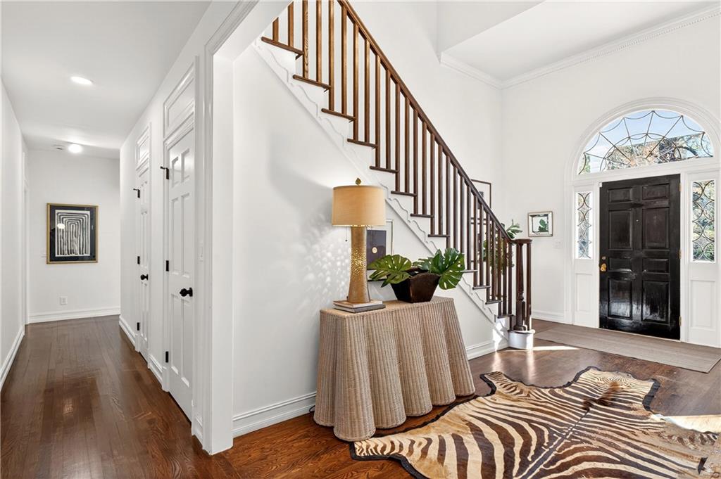 1330 West Wesley Road Northwest Atlanta, GA 30327 - Photo 5 of 46 a bedroom with two beds and a chandelier