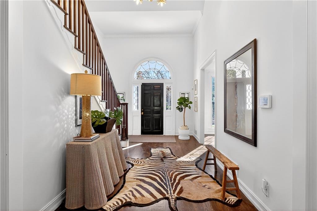 1330 West Wesley Road Northwest Atlanta, GA 30327 - Photo 6 of 46 a living room with furniture a fireplace and a chandelier