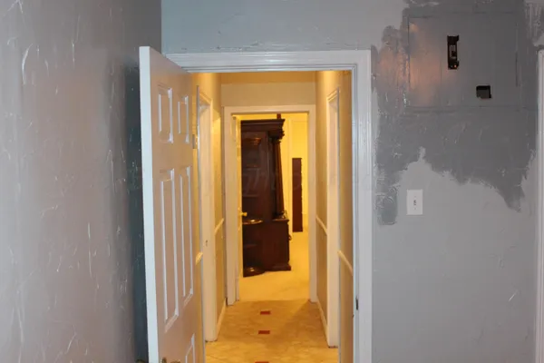 a view of a bathroom that has a glass door shower