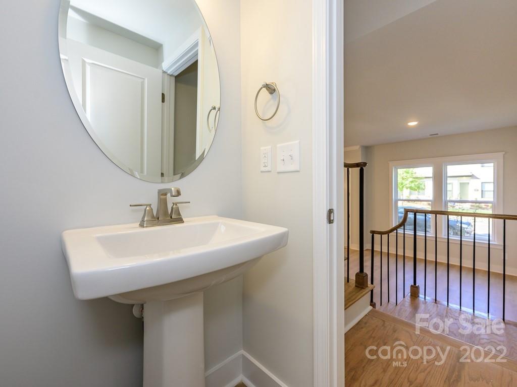5915 Ardrey Kell Road Charlotte, NC 28105 - Photo 15 of 32 a bathroom with a sink and mirror