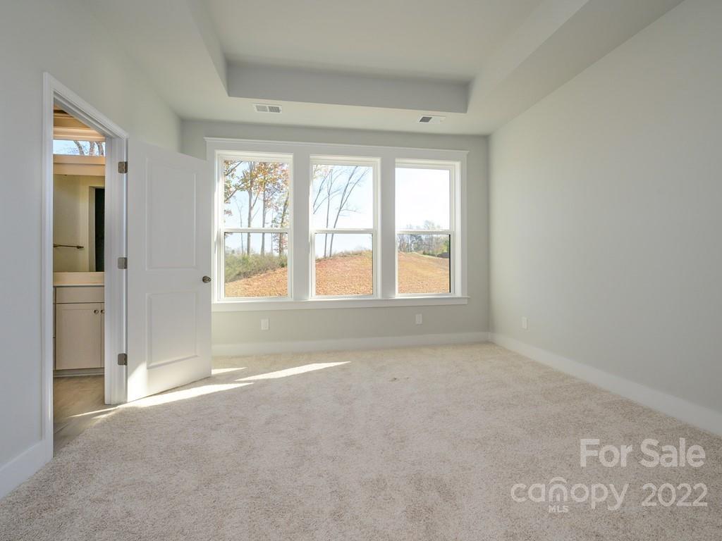 5915 Ardrey Kell Road Charlotte, NC 28105 - Photo 16 of 32 a view of an empty room with a window