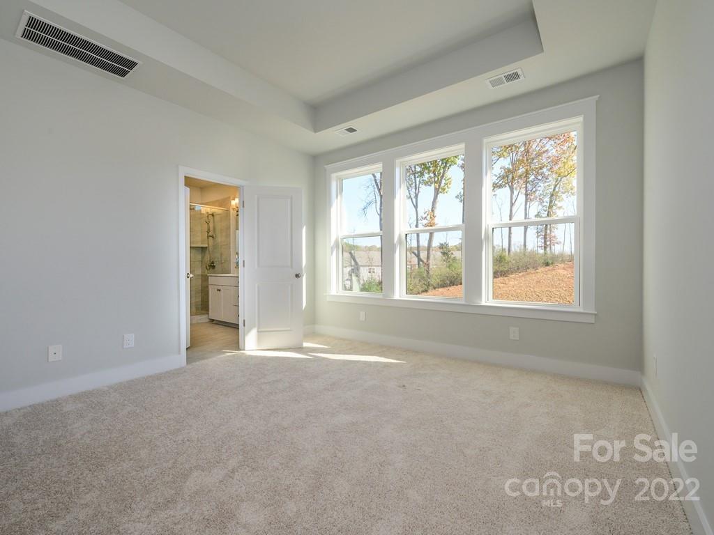 5915 Ardrey Kell Road Charlotte, NC 28105 - Photo 18 of 32 a view of an empty room with a window