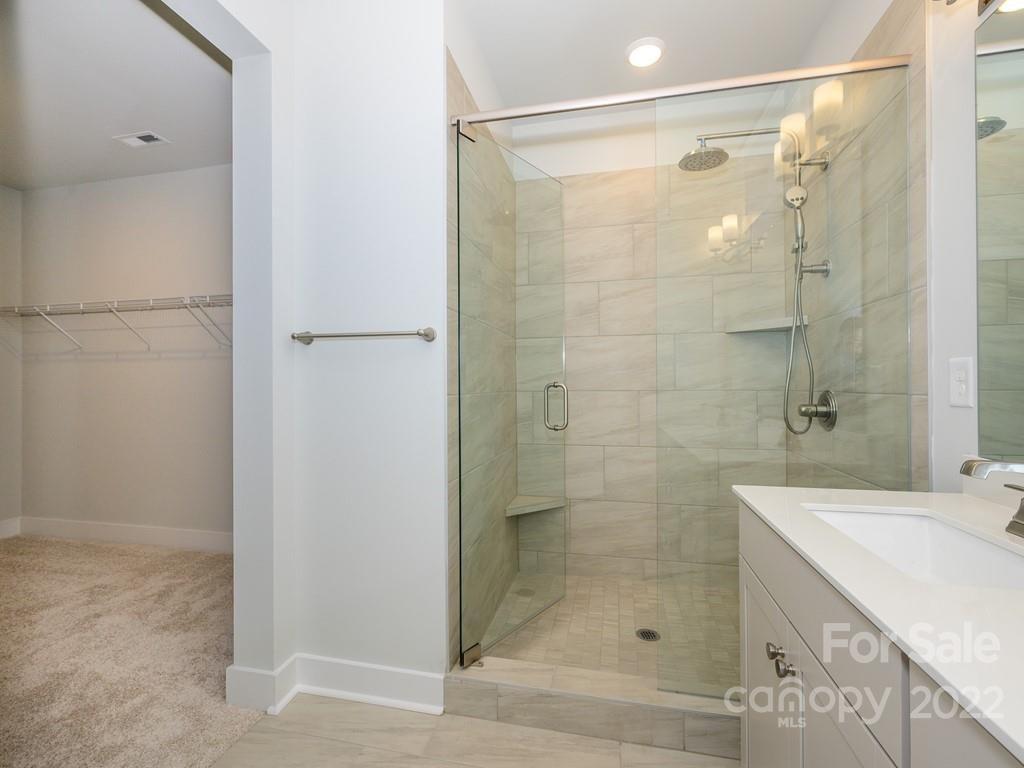 5915 Ardrey Kell Road Charlotte, NC 28105 - Photo 20 of 32 a bathroom with a shower and a sink
