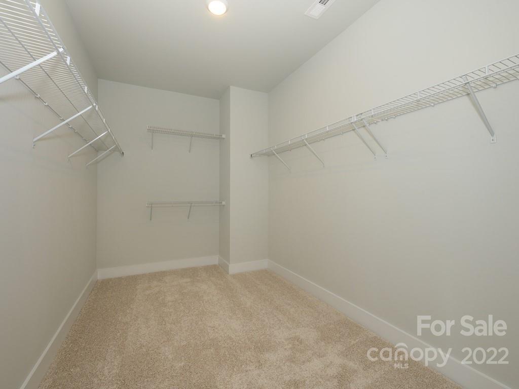5915 Ardrey Kell Road Charlotte, NC 28105 - Photo 21 of 32 a view of an empty walk in closet