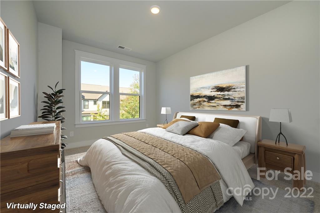 5915 Ardrey Kell Road Charlotte, NC 28105 - Photo 22 of 32 a bedroom with a bed and a window