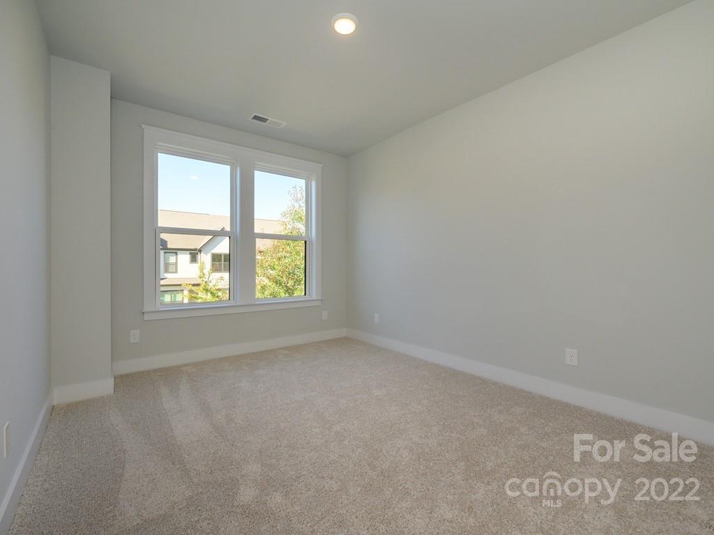 5915 Ardrey Kell Road Charlotte, NC 28105 - Photo 23 of 32 a view of an empty room with a window