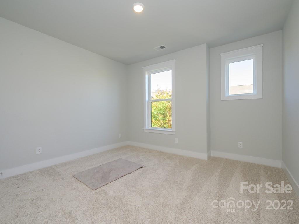 5915 Ardrey Kell Road Charlotte, NC 28105 - Photo 25 of 32 an empty room with windows