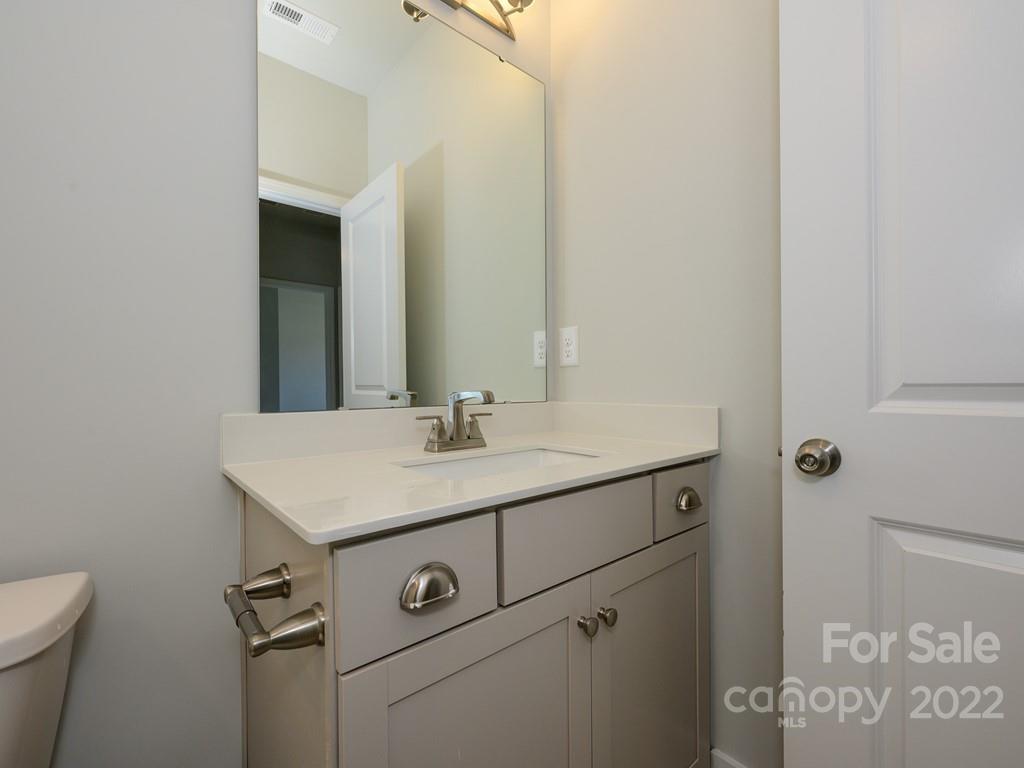 5915 Ardrey Kell Road Charlotte, NC 28105 - Photo 26 of 32 a bathroom with a sink toilet and vanity
