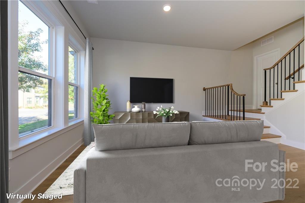 5915 Ardrey Kell Road Charlotte, NC 28105 - Photo 3 of 32 a living room with furniture and a flat screen tv