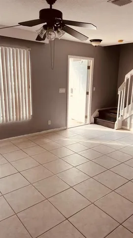 a view of an empty room and a window