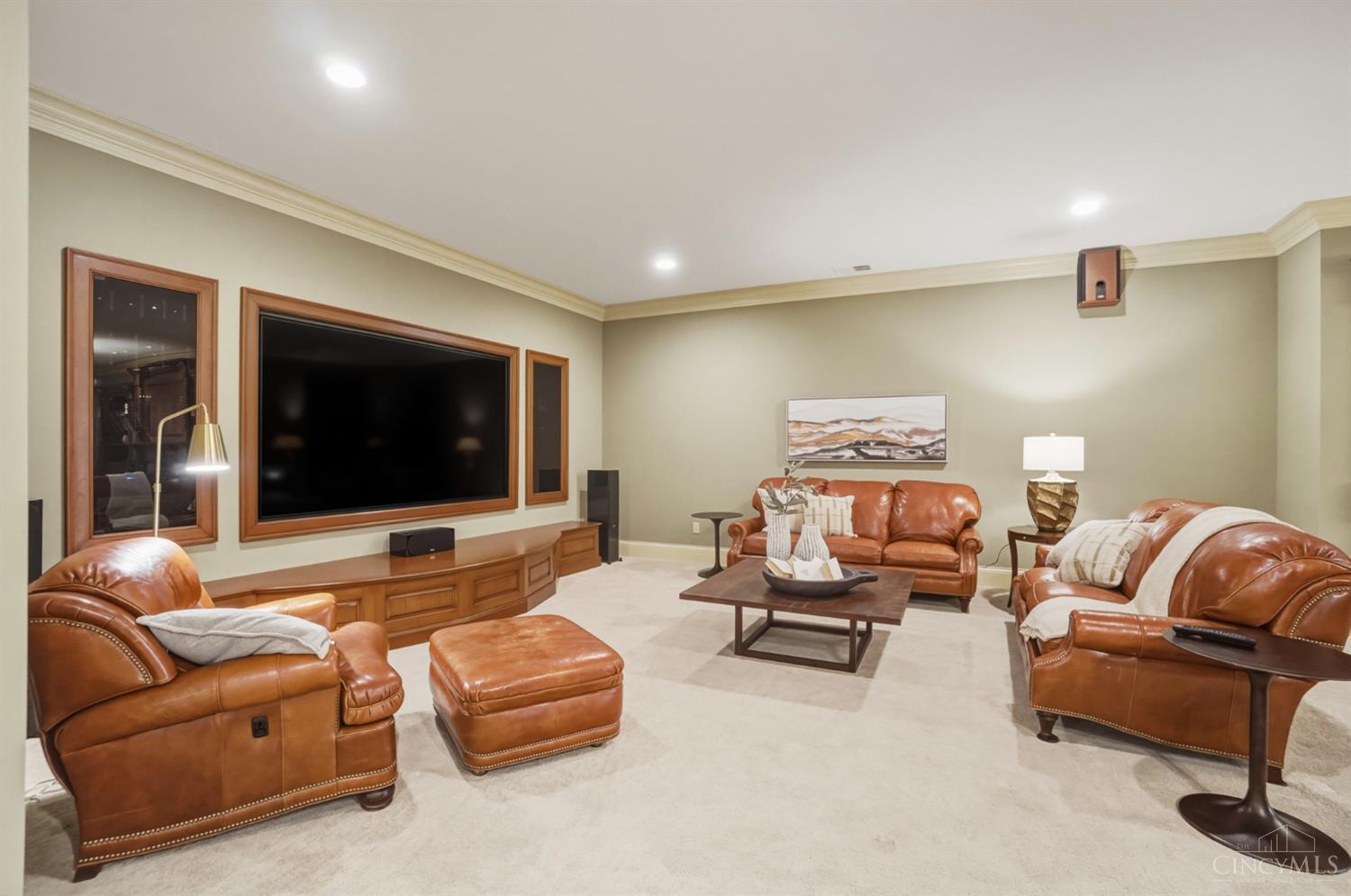 1054 Observatory Point Maineville, OH 45039 - Photo 52 of 82 Now on to the walkout basement with a big screen and surround sound.