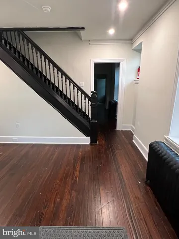 a view of entryway with wooden floor