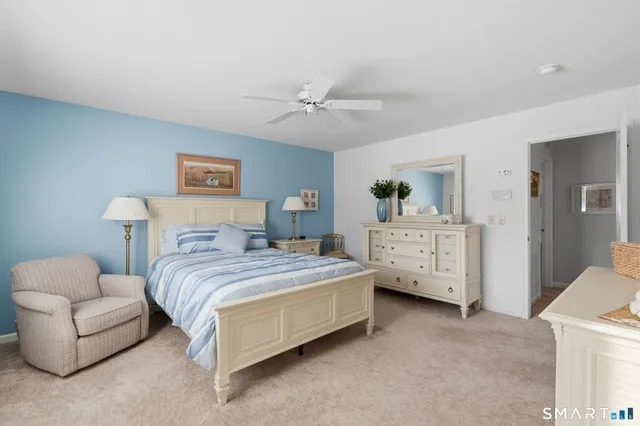 a bedroom with bed and window