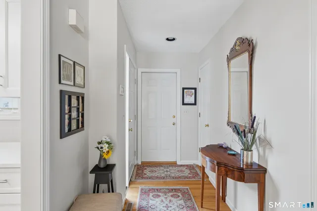 a living room with furniture and a rug