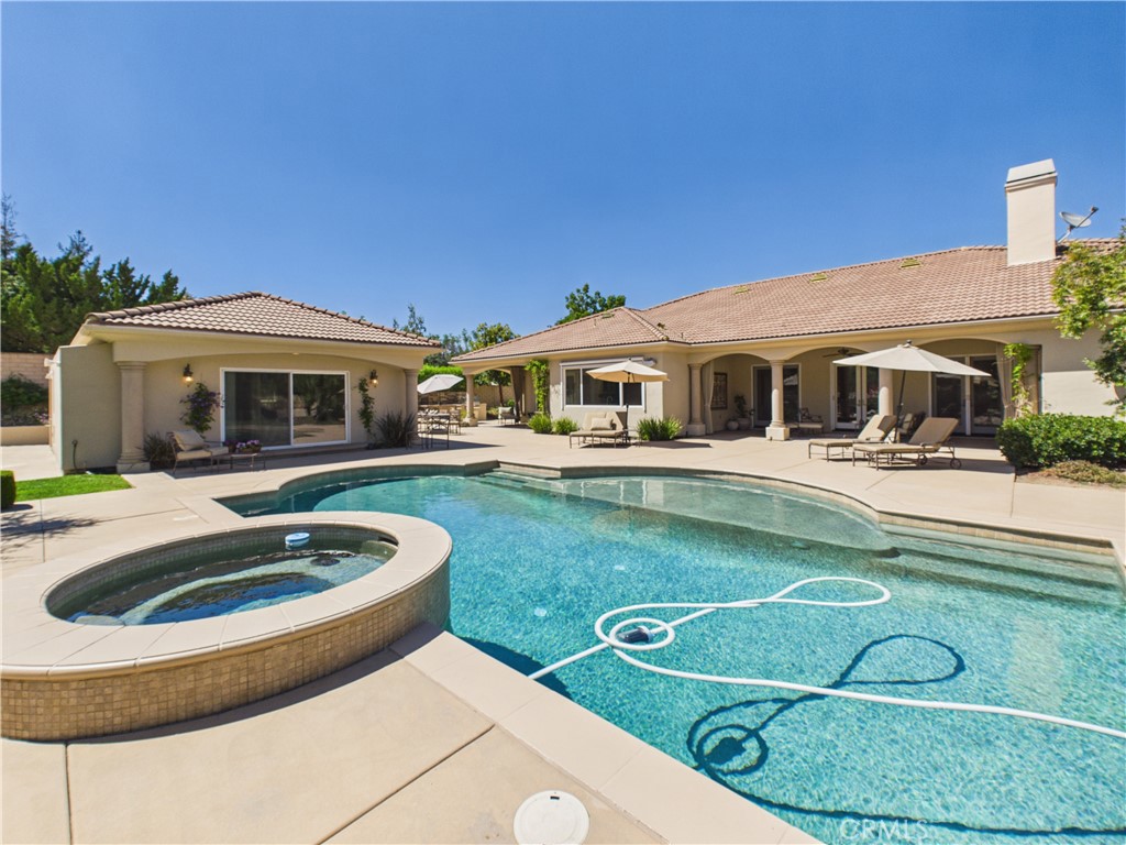 1662 Cherokee Road Corona, CA 92881 - Photo 40 of 60 a view of a house with swimming pool and a yard