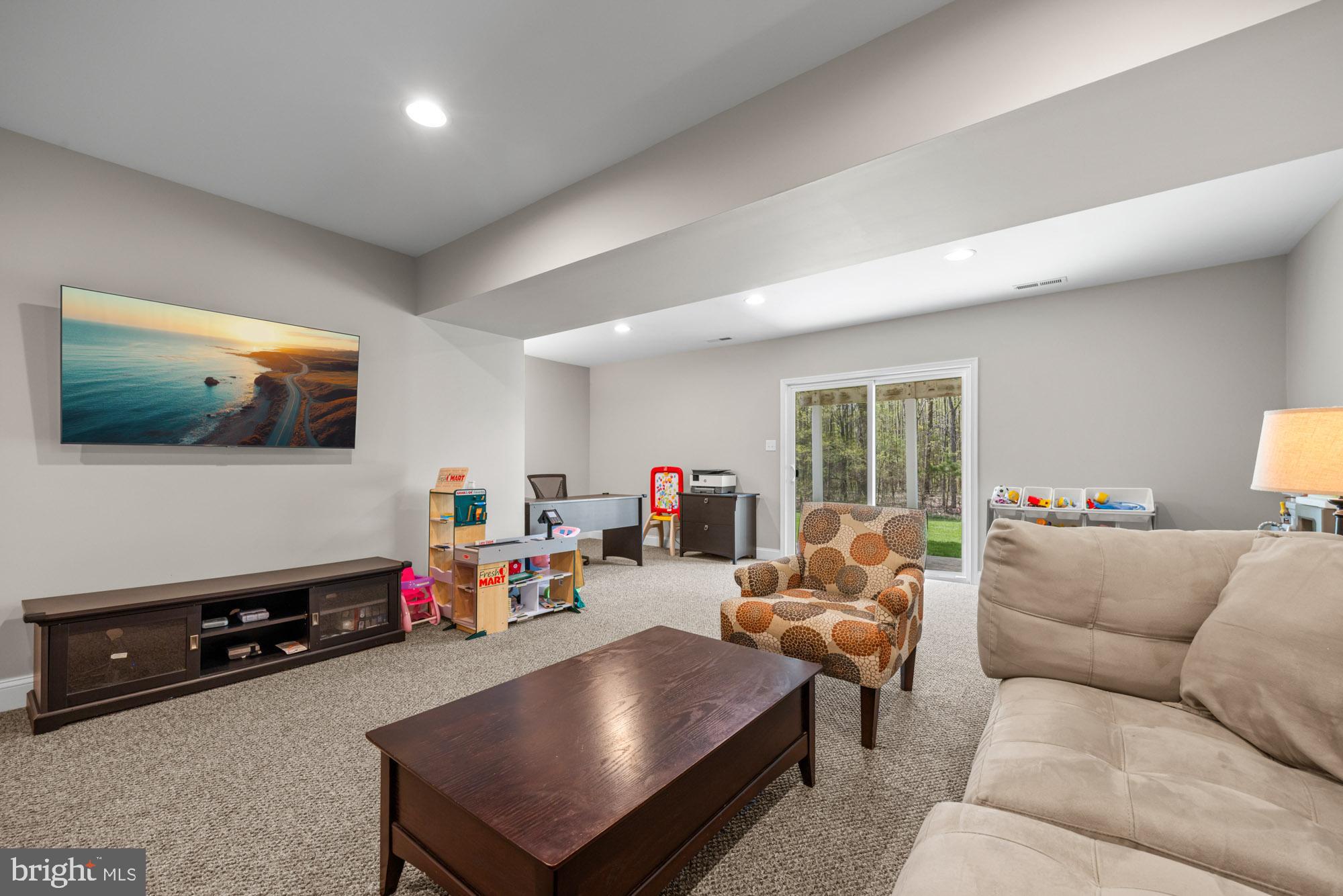 89 Isabelle Court Marlton, NJ 08053 - Photo 16 of 31 a living room with furniture and a flat screen tv