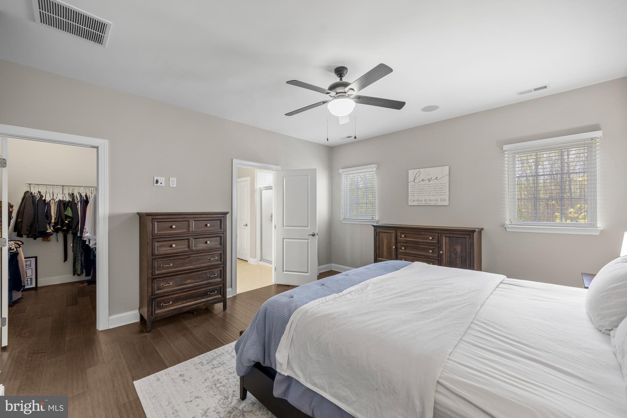 89 Isabelle Court Marlton, NJ 08053 - Photo 20 of 31 a bedroom with a bed and a chandelier