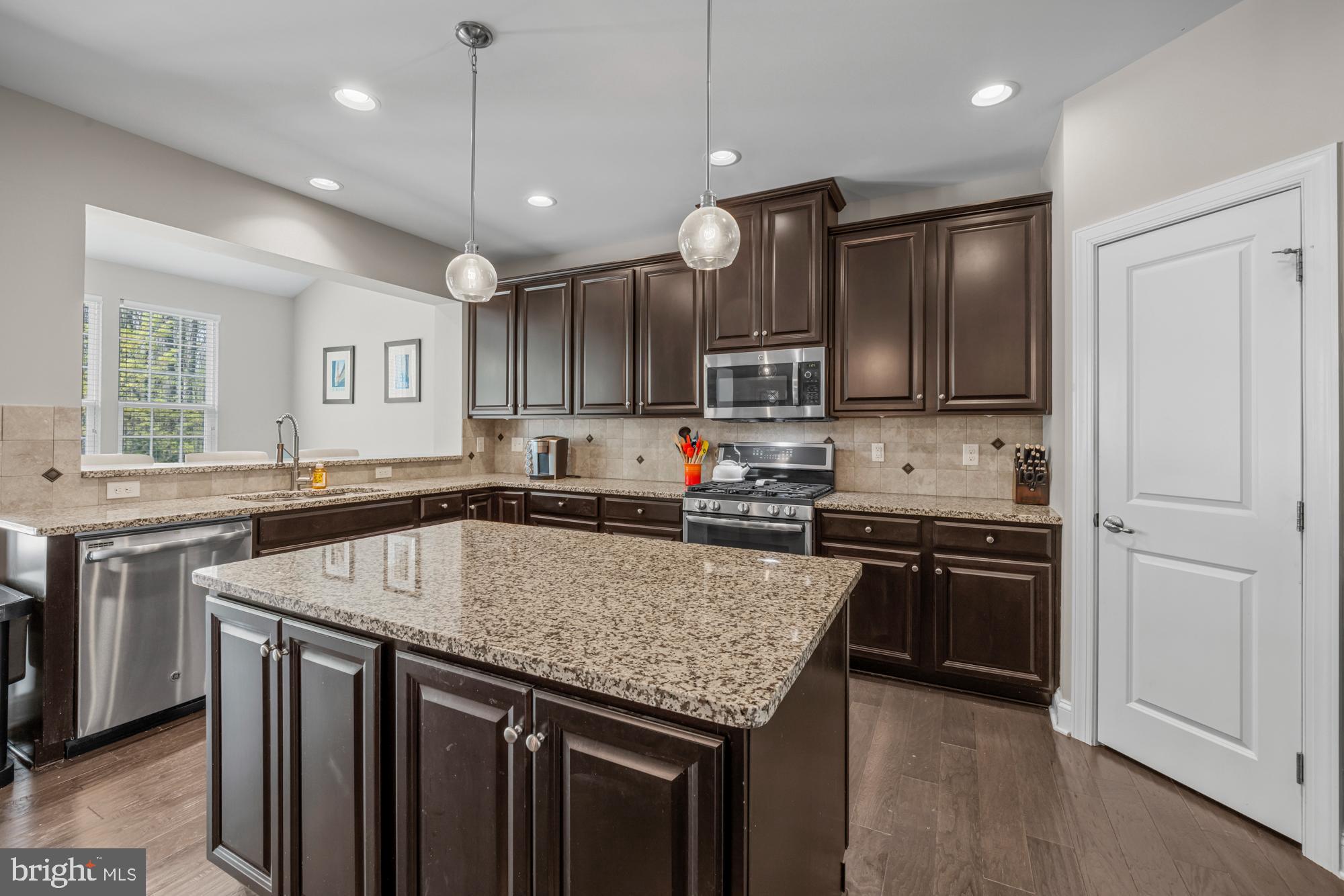 89 Isabelle Court Marlton, NJ 08053 - Photo 6 of 31 a kitchen with stainless steel appliances granite countertop a sink stove and refrigerator