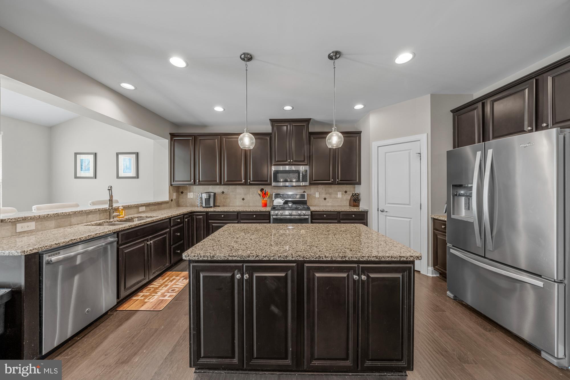 89 Isabelle Court Marlton, NJ 08053 - Photo 7 of 31 a kitchen with stainless steel appliances granite countertop a sink stove and refrigerator