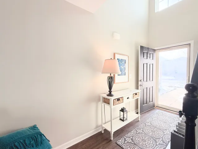 a view of a livingroom with furniture and a window