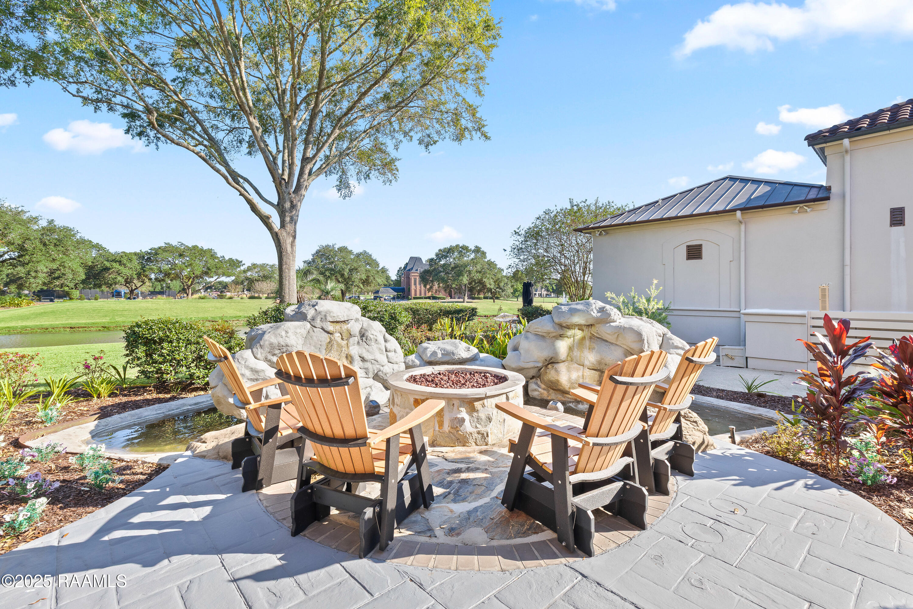 306 Sawgrass Lane Broussard, LA 70518 - Photo 28 of 33 Custom waterfall and fire pit