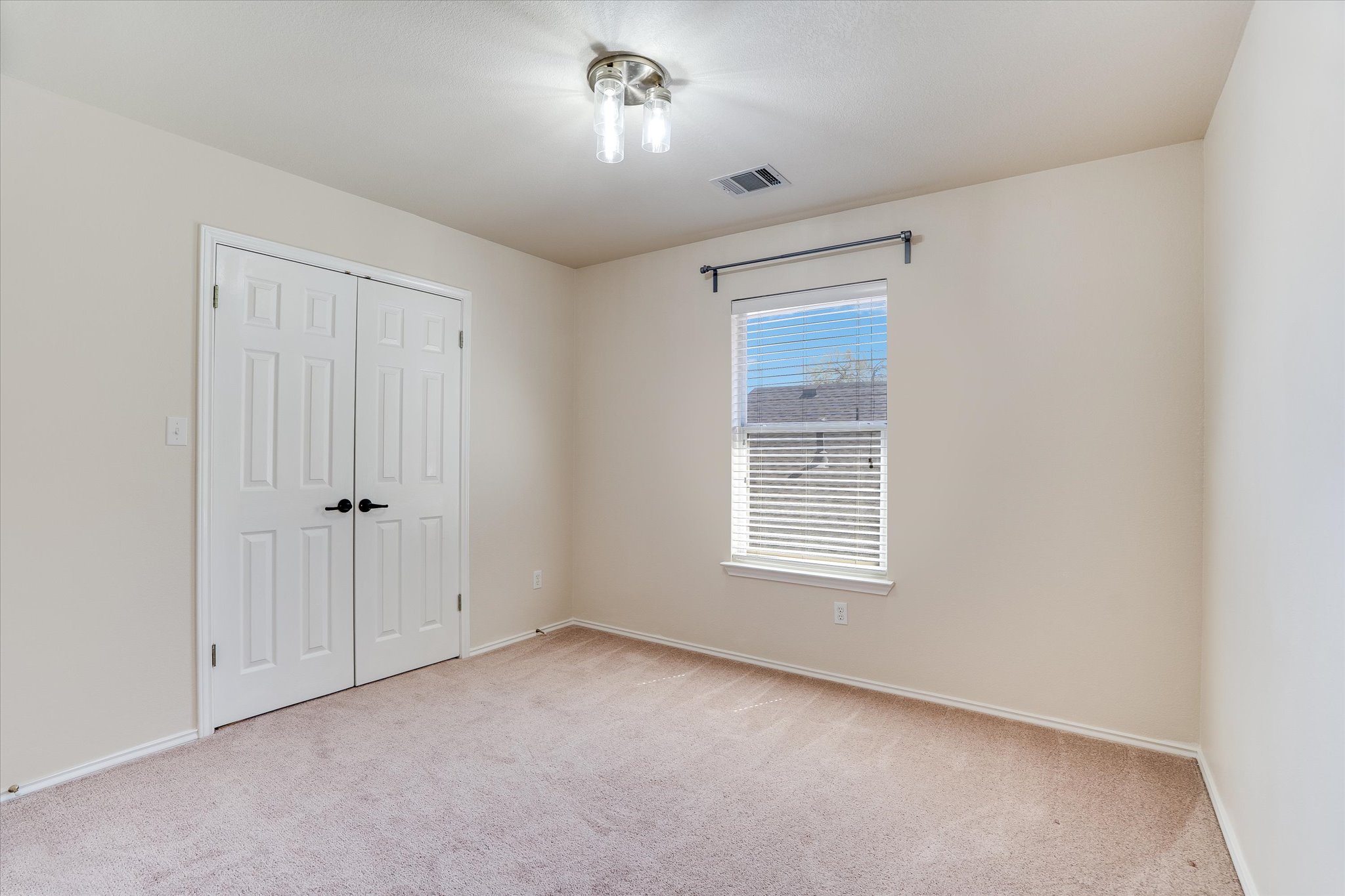2207 Clover Ridge Drive Cedar Park, TX 78613 - Photo 13 of 21 a view of an empty room with a window