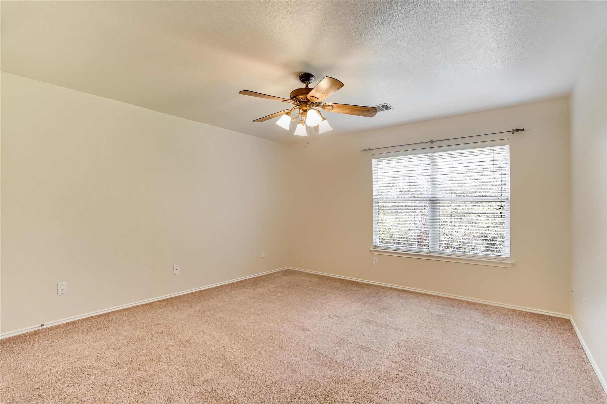 2207 Clover Ridge Drive Cedar Park, TX 78613 - Photo 14 of 21 a view of a room with a window and a chandelier fan