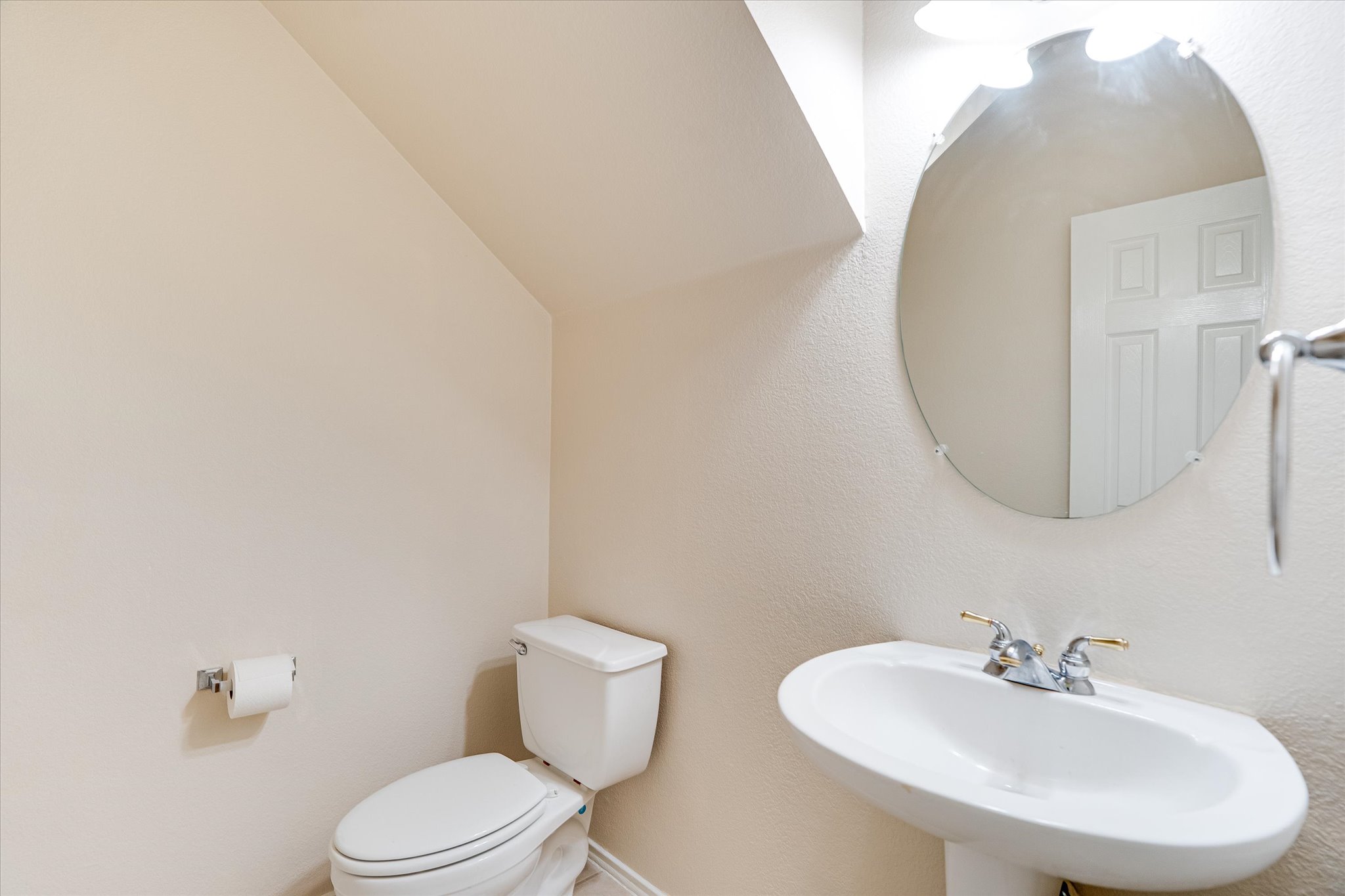 2207 Clover Ridge Drive Cedar Park, TX 78613 - Photo 17 of 21 a bathroom with a toilet a sink and mirror