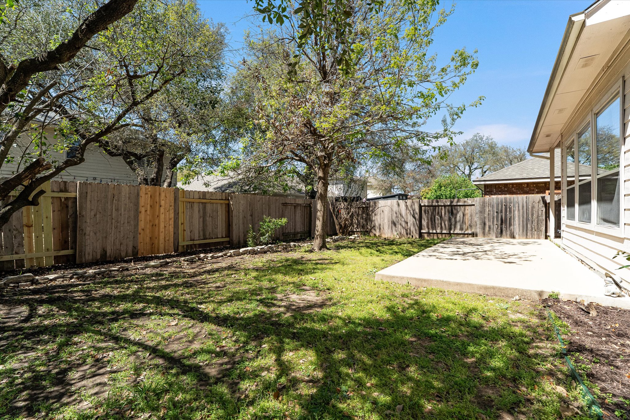 2207 Clover Ridge Drive Cedar Park, TX 78613 - Photo 20 of 21 a backyard of a house with table and chairs