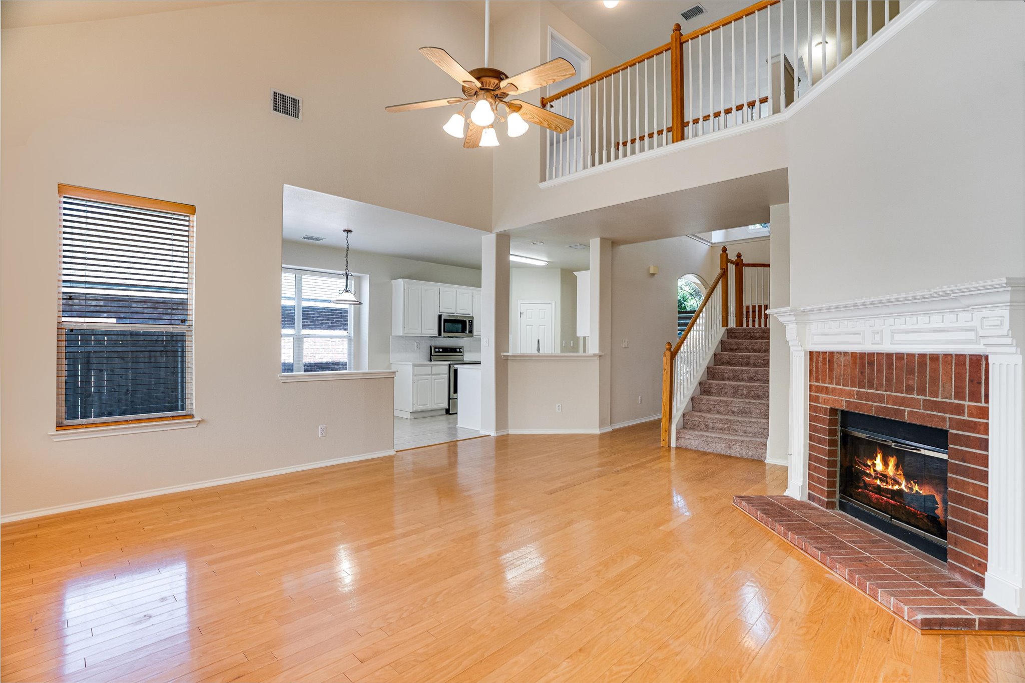 2207 Clover Ridge Drive Cedar Park, TX 78613 - Photo 6 of 21 a view of an empty room with a fireplace and a window