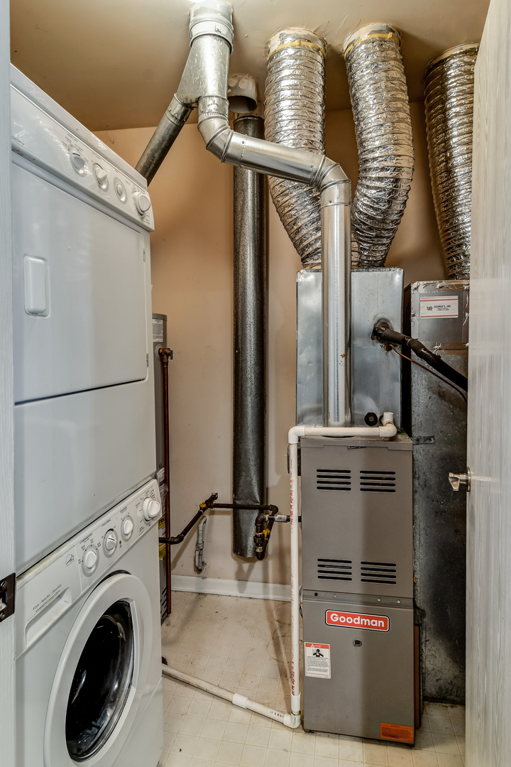 11 Foxcroft Road, Unit 219 Naperville, IL 60565 - Photo 12 of 16 a utility room with dryer and washer