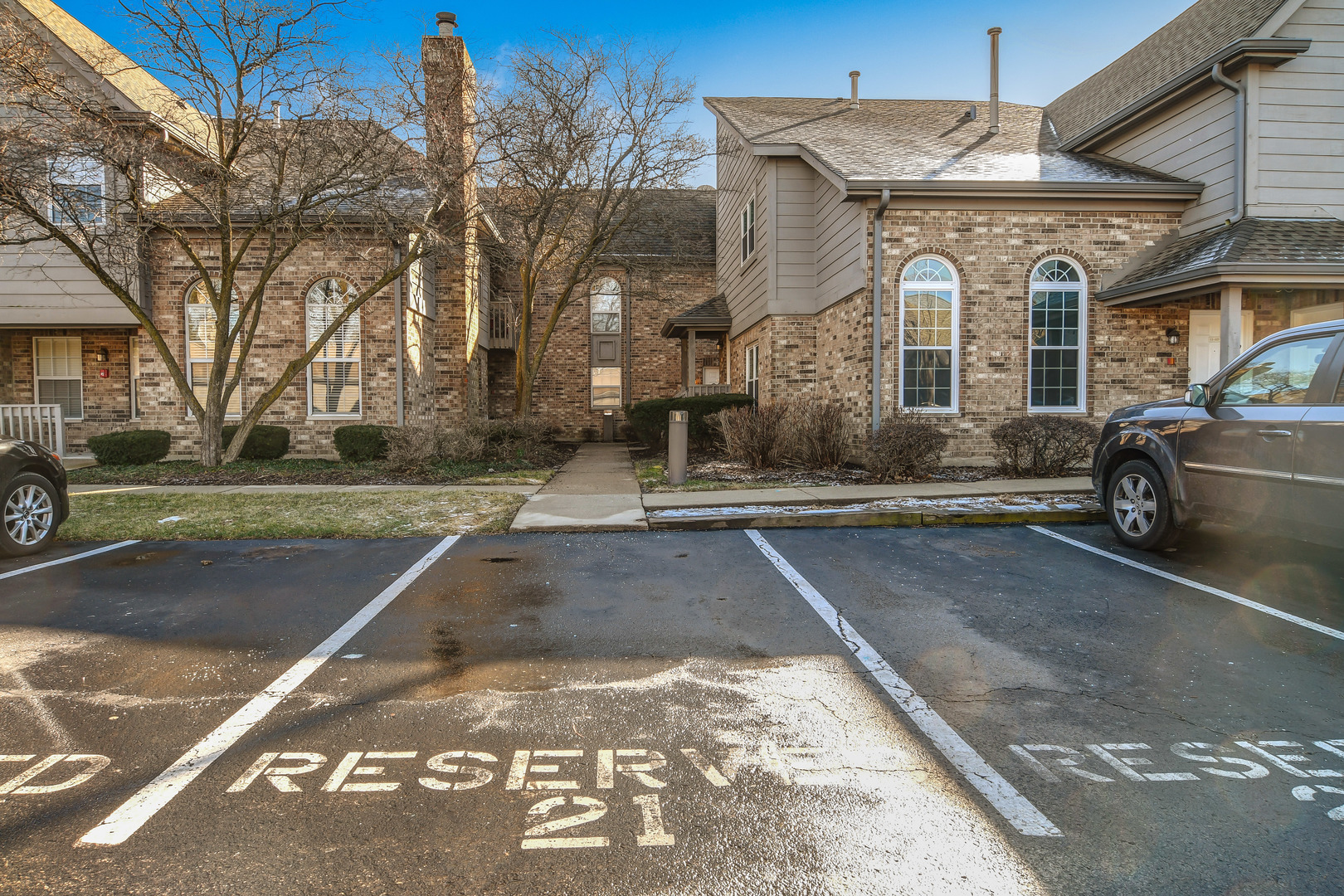 11 Foxcroft Road, Unit 219 Naperville, IL 60565 - Photo 14 of 16 a front view of a house with a yard