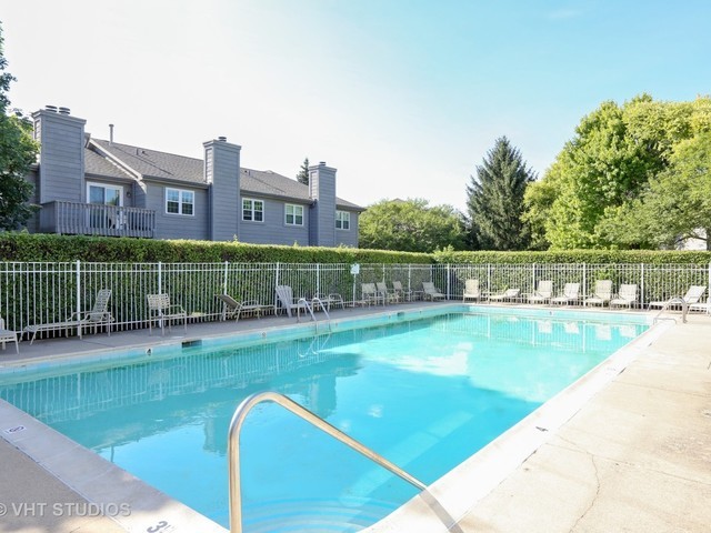 11 Foxcroft Road, Unit 219 Naperville, IL 60565 - Photo 16 of 16 a view of a swimming pool with a garden