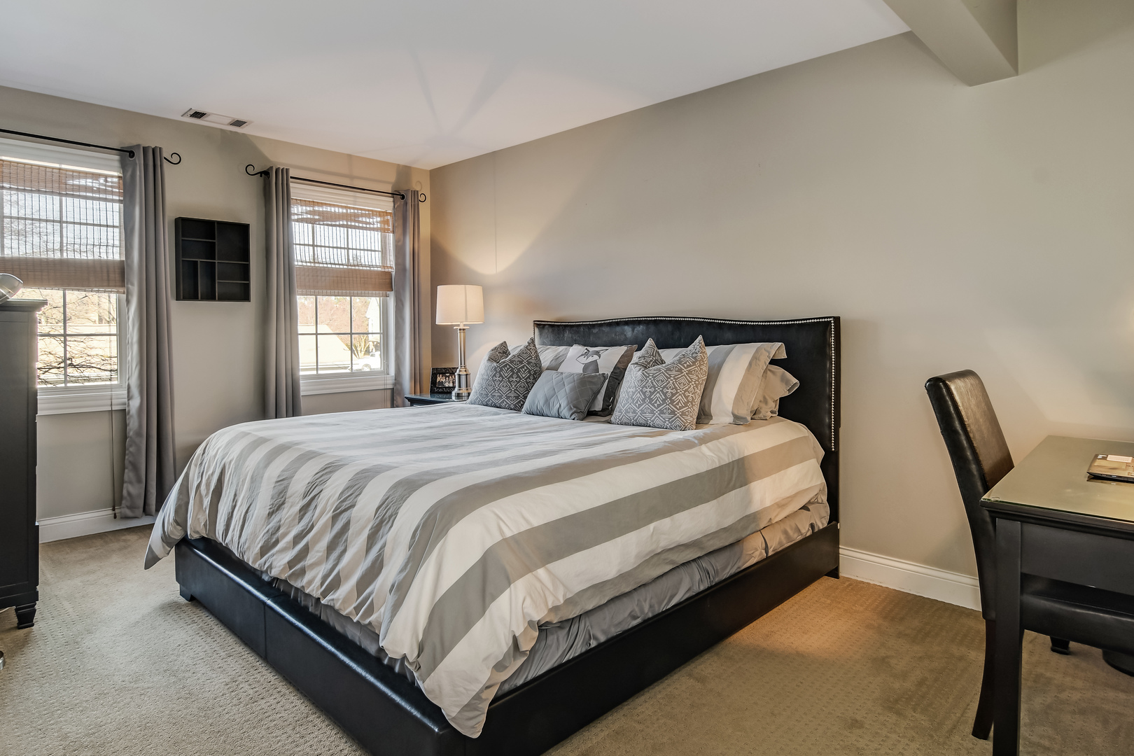 11 Foxcroft Road, Unit 219 Naperville, IL 60565 - Photo 9 of 16 a large bed sitting in a bedroom next to a window