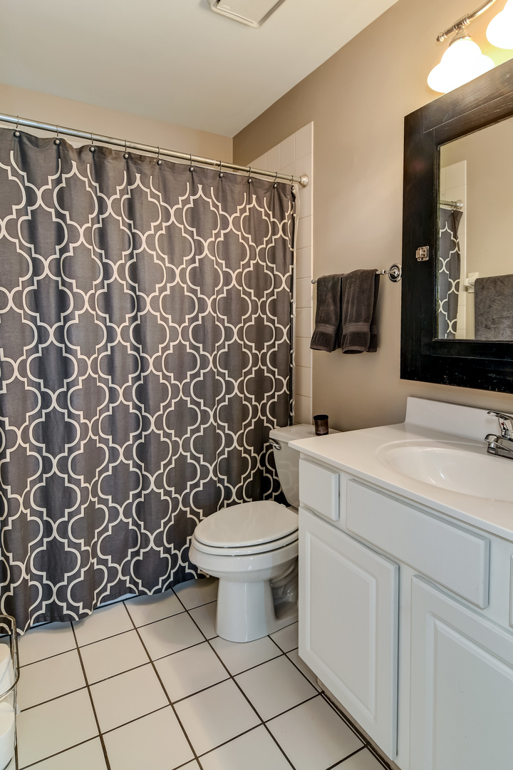 11 Foxcroft Road, Unit 219 Naperville, IL 60565 - Photo 10 of 16 a bathroom with a toilet and a sink