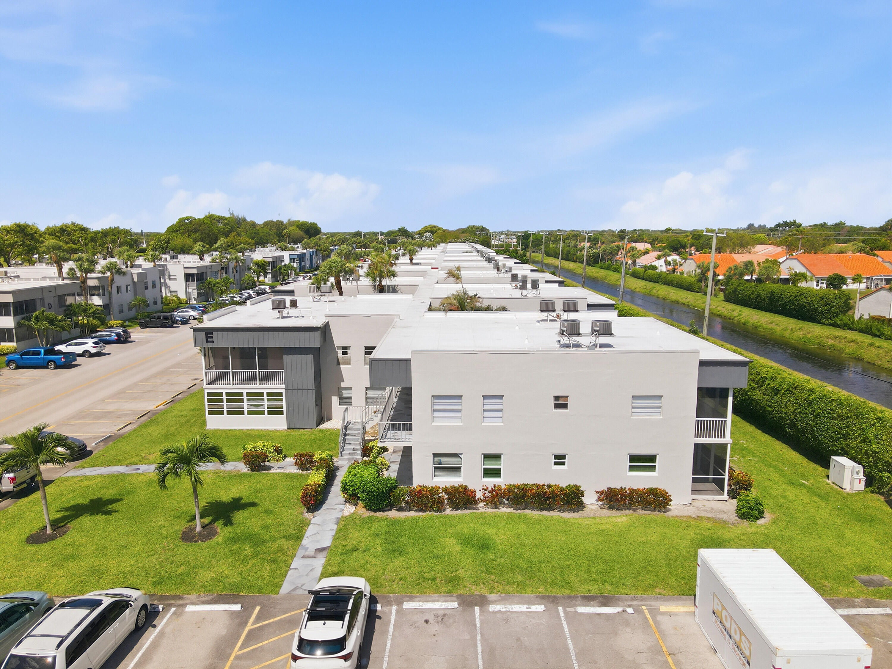 226 Normandy Lane, Unit E Delray Beach, FL 33484 - Photo 19 of 35 a view of a city with tall buildings and a big yard