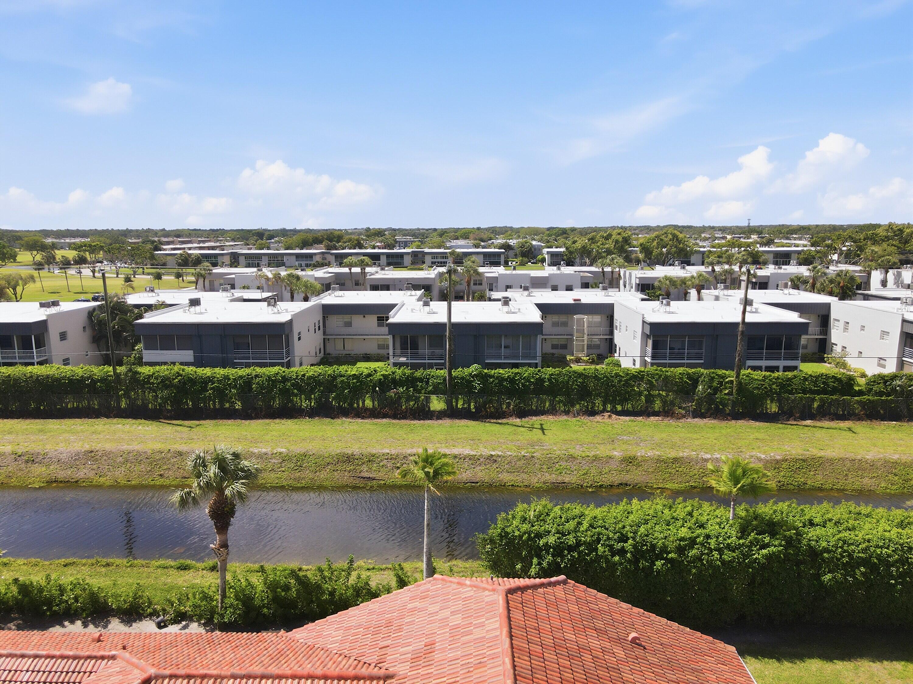 226 Normandy Lane, Unit E Delray Beach, FL 33484 - Photo 2 of 35 a view of a city with an ocean