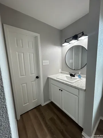 a bathroom with a sink and a mirror