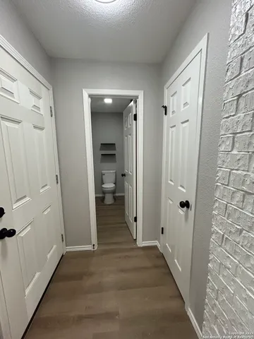 a view of a hallway with a room