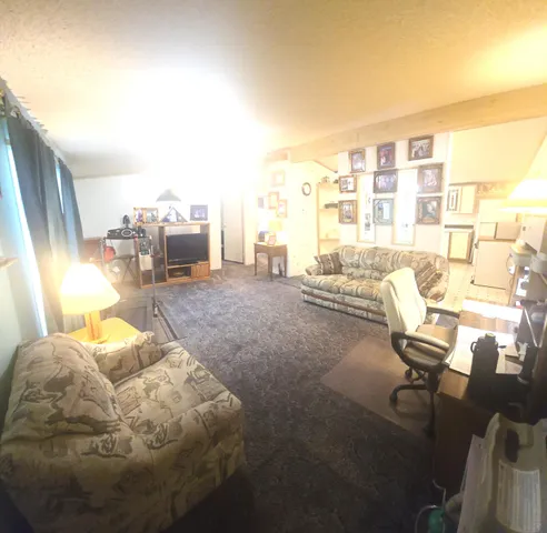 a living room with furniture and a table