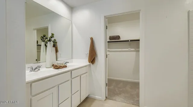 a bedroom with double bed and a window