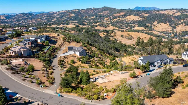 an aerial view of residential houses and outdoor space